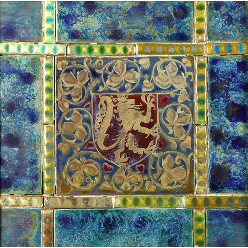 37 - Pilkingtons Royal Lancastrian framed pottery tiles, central tile, lion in a shield, surrounded by sm... 