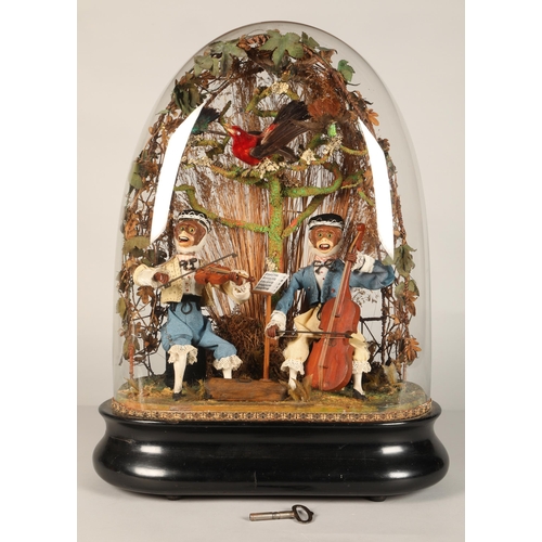 272 - An antique musical automaton under a glass dome, two monkey musicians, a violinist, and a cello play... 