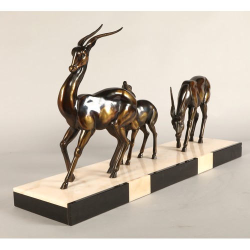 243 - Three Art Deco Gazelles on marble plinth, 65 x 17 x 36 cm