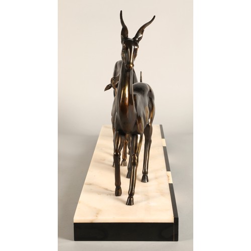 243 - Three Art Deco Gazelles on marble plinth, 65 x 17 x 36 cm