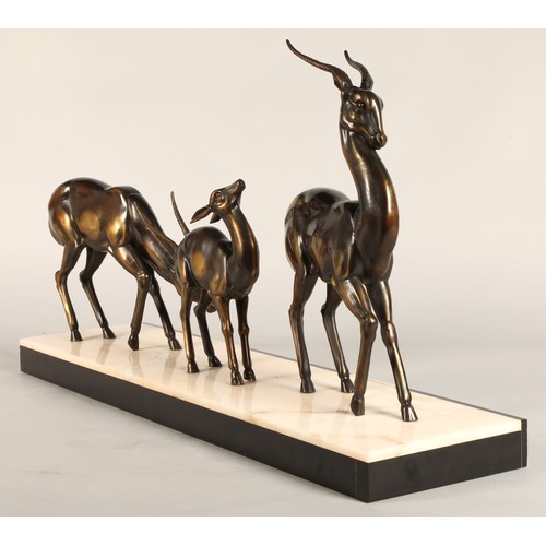 243 - Three Art Deco Gazelles on marble plinth, 65 x 17 x 36 cm