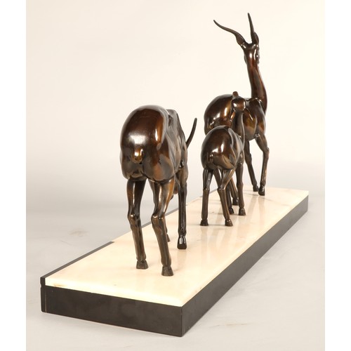 243 - Three Art Deco Gazelles on marble plinth, 65 x 17 x 36 cm