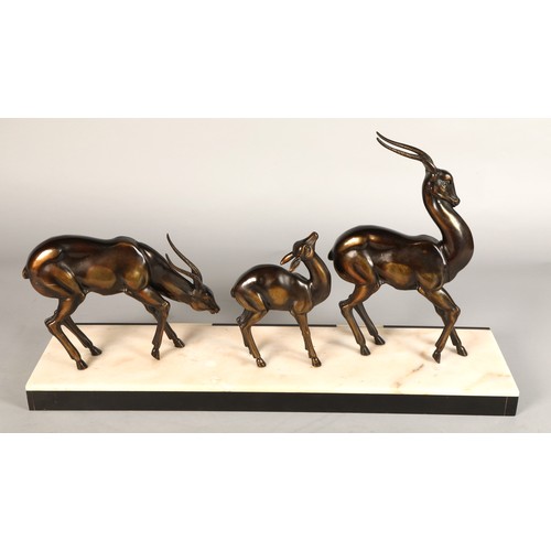 243 - Three Art Deco Gazelles on marble plinth, 65 x 17 x 36 cm