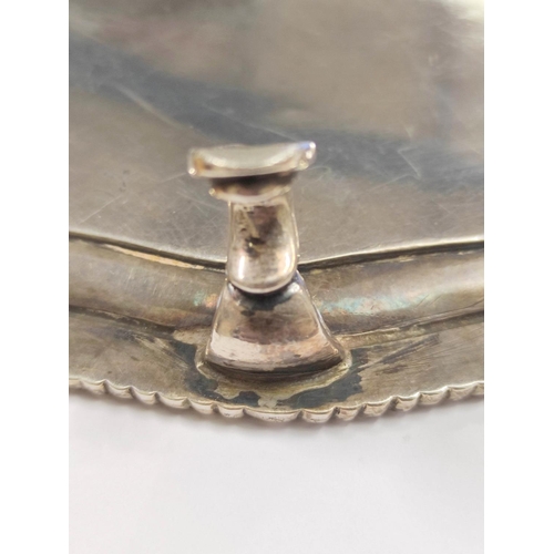 65 - Silver circular waiter with hexafoil lobed gadrooned edge, crested, on pad feet by Peter and Anne Ba... 