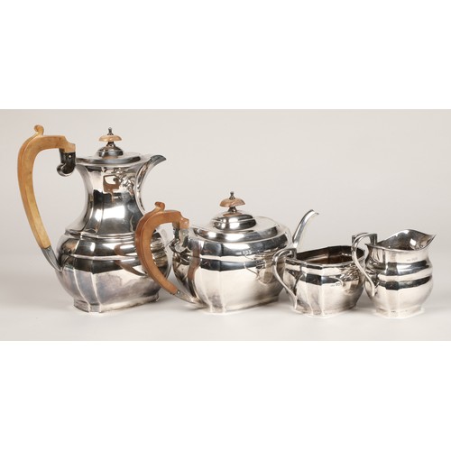 185 - Four piece silver tea service, with hard wood stylised handles, assay marked Sheffield 1968, 1770 gr... 