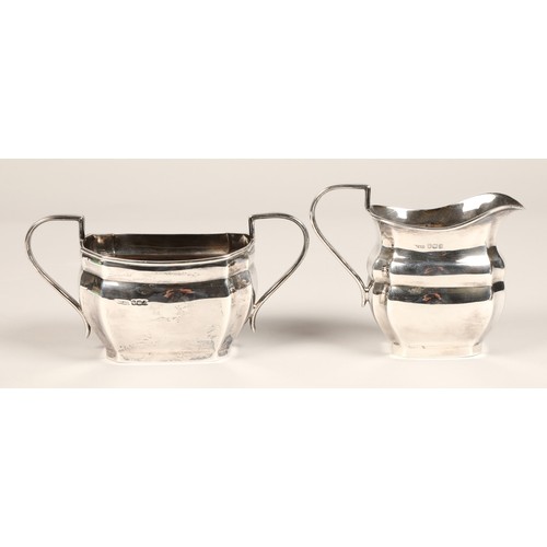 185 - Four piece silver tea service, with hard wood stylised handles, assay marked Sheffield 1968, 1770 gr... 