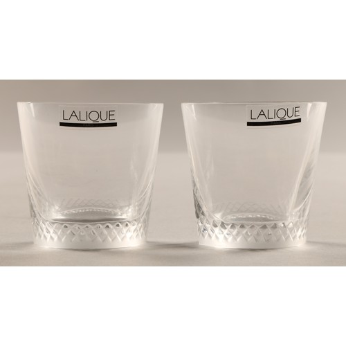 232 - Pair of small Lalique whisky tumblers, etched Lalique France to the base, 6.5 cm high in Lalique box... 