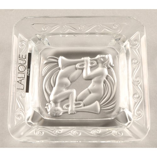 236 - Lalique ashtray depicting two trumpeters, etched Lalique France to base, 8cm x 8cm , in Lalique box