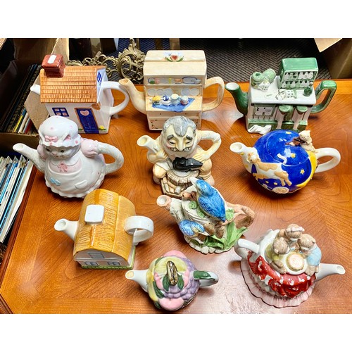 269 - Ten novelty teapots