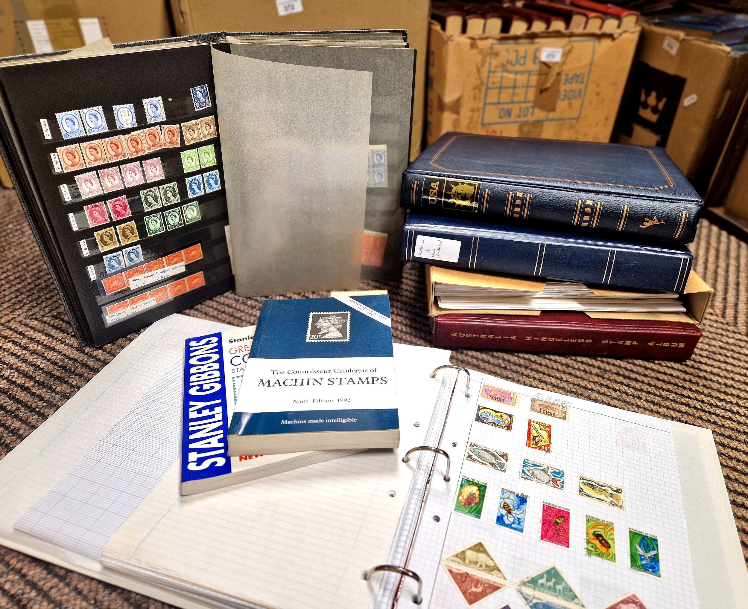 Six stamp albums and two books on collecting