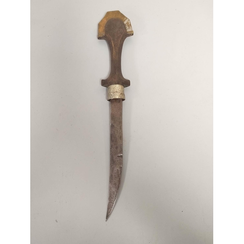 348 - Arabic Jambiya dagger of elongated form with white metal and brass mounts and wooden handle. 