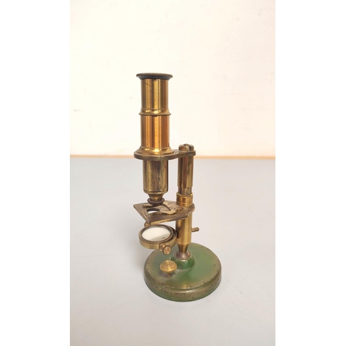 459 - A miniature brass compendium microscope in original wooden case, height 16.5cm