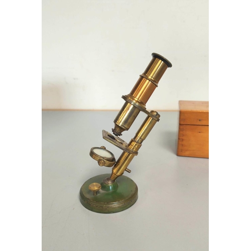 459 - A miniature brass compendium microscope in original wooden case, height 16.5cm