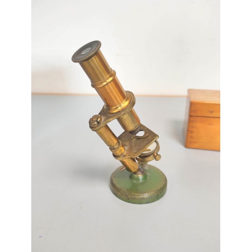 459 - A miniature brass compendium microscope in original wooden case, height 16.5cm