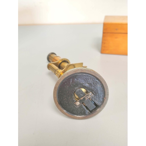 459 - A miniature brass compendium microscope in original wooden case, height 16.5cm