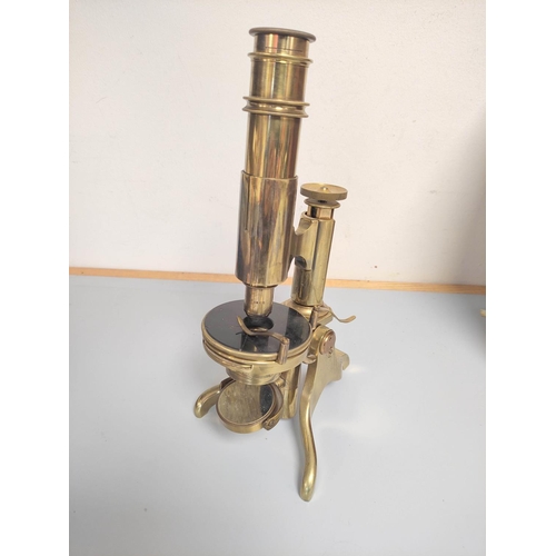 463 - An unattributed mid Victorian monocular petrological microscope of gilt brass construction, concave ... 