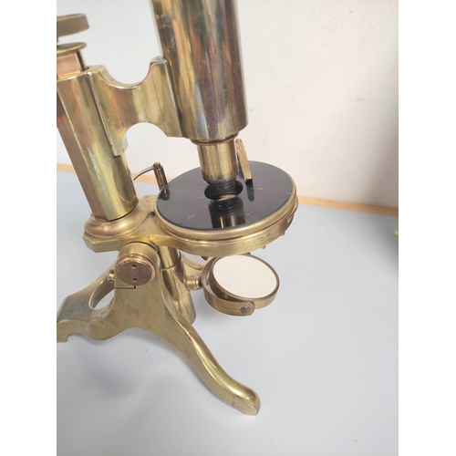 463 - An unattributed mid Victorian monocular petrological microscope of gilt brass construction, concave ... 