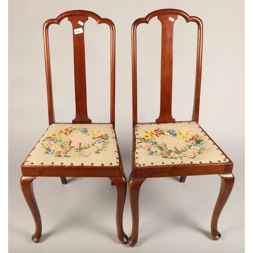 591 - Pair of mahogany hall chairs, with floral tapestry seats (2)