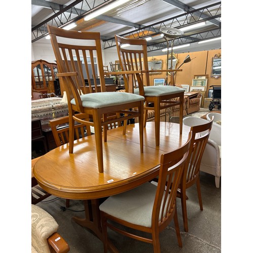 602 - Contemporary Stag oval extendable dining table with two carvers and four dining chairs (7)