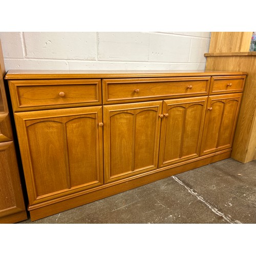 605 - Stag sideboard, bookcase with drawer and cupboard  (2)