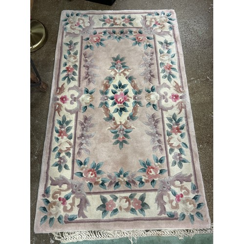 619 - Cream and floral woolen rug, 152 x 92 cm