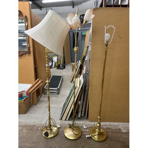 620 - Three brass style free standing lights (3)