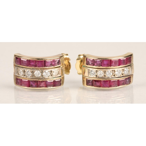 104 - Pair of ladies 18ct yellow gold Ruby and Diamond earrings, central row of five diamonds flanked by a... 