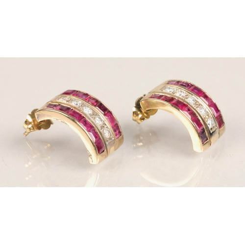 104 - Pair of ladies 18ct yellow gold Ruby and Diamond earrings, central row of five diamonds flanked by a... 