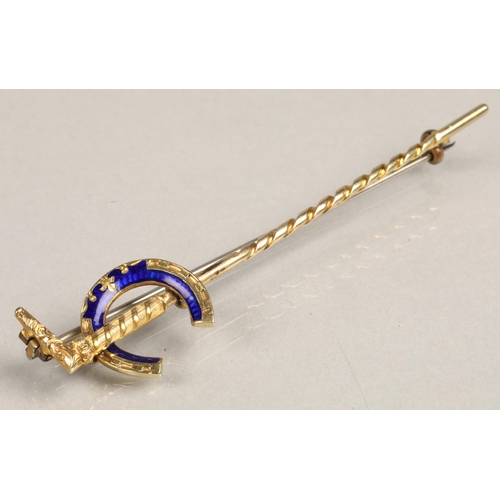 95 - Ladies yellow metal brooch in the form of a walking stick with blue enamelled letter C, in a fitted ... 