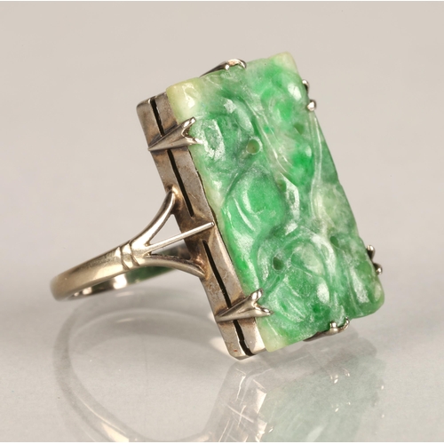 96 - Ladies carved jade ring,mounted on white metal, ring size L/M.