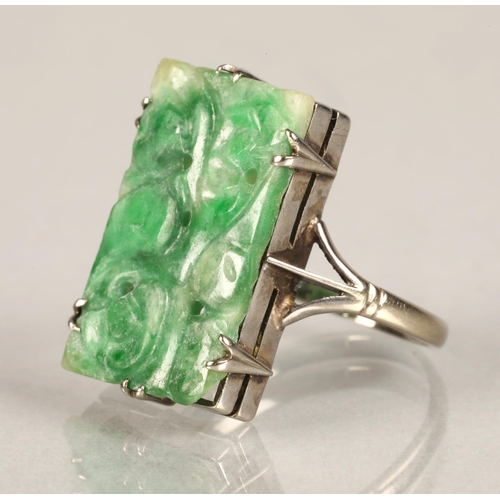 96 - Ladies carved jade ring,mounted on white metal, ring size L/M.