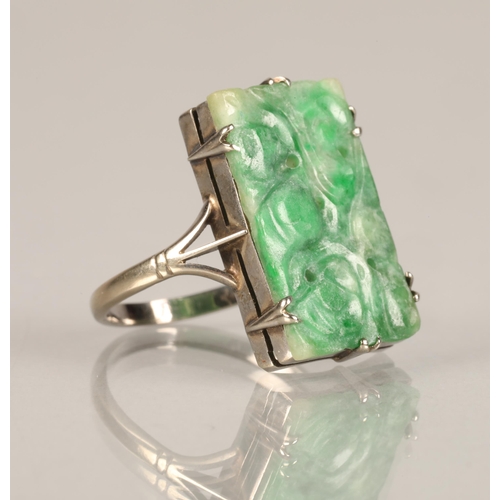 96 - Ladies carved jade ring,mounted on white metal, ring size L/M.