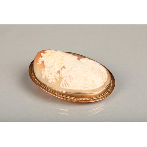 138 - Victorian 9ct gold framed shall cameo brooch, the shell carved in relief with depiction of Diana wit... 