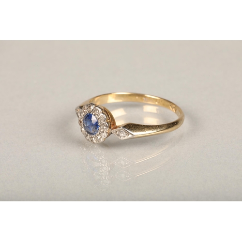 139 - An Art Deco period sapphire and diamond daisy cluster ring, the central round cut sapphire set betwe... 