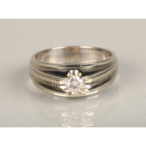 141 - 18ct white gold diamond solitaire ring, the brilliant cut diamond set in an integral mount flanked b... 