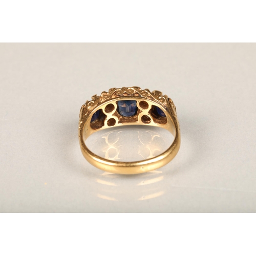 144 - Early 20th century 18ct gold three stone sapphire and diamond ring, the oval sapphires interspaced w... 