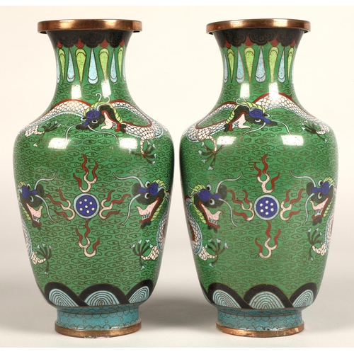 220 - Pair of Japanese cloisonne vases, green ground with coiled dragon, 23cm high.