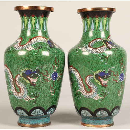 220 - Pair of Japanese cloisonne vases, green ground with coiled dragon, 23cm high.