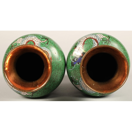 220 - Pair of Japanese cloisonne vases, green ground with coiled dragon, 23cm high.