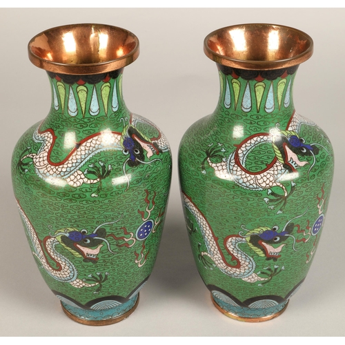 220 - Pair of Japanese cloisonne vases, green ground with coiled dragon, 23cm high.