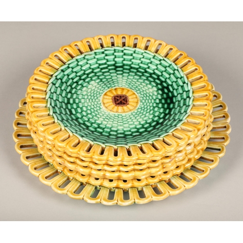 42 - Seven piece Wedgwood majolica fruit set, with green lustre weave effect with yellow pierced border.