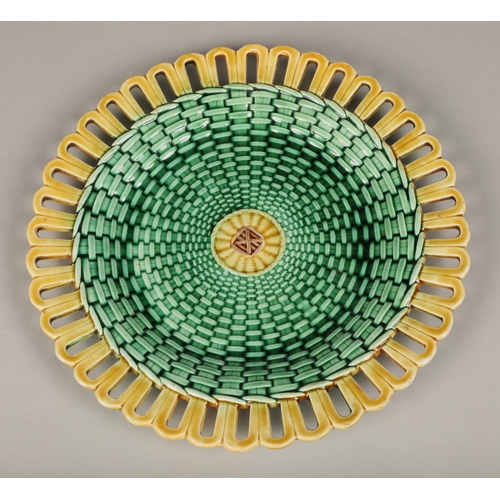 42 - Seven piece Wedgwood majolica fruit set, with green lustre weave effect with yellow pierced border.