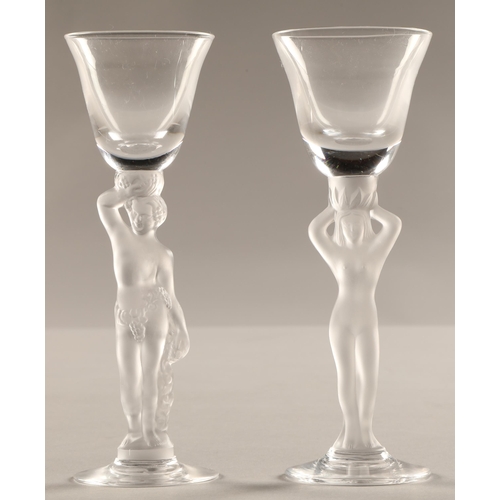 234 - Pair of glasses with frosted figure stems, 15cm high.