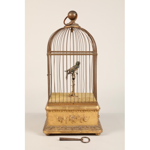 279 - A 19th century mechanical singing bird in a cage, mounted on a gilded base, 55cm high.