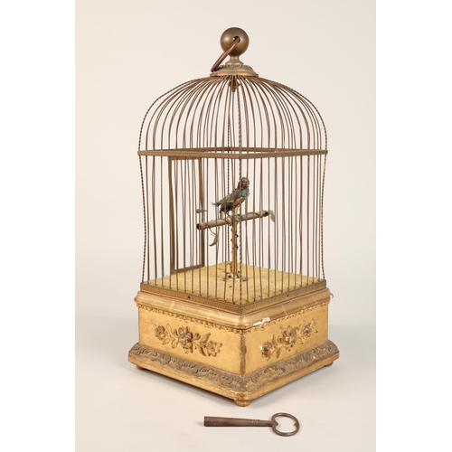 279 - A 19th century mechanical singing bird in a cage, mounted on a gilded base, 55cm high.