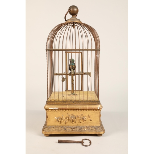 279 - A 19th century mechanical singing bird in a cage, mounted on a gilded base, 55cm high.