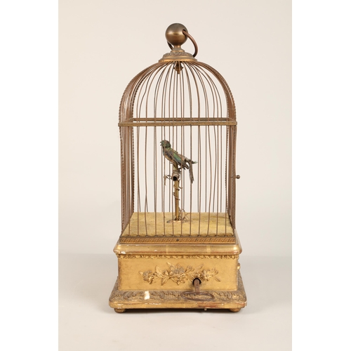 279 - A 19th century mechanical singing bird in a cage, mounted on a gilded base, 55cm high.