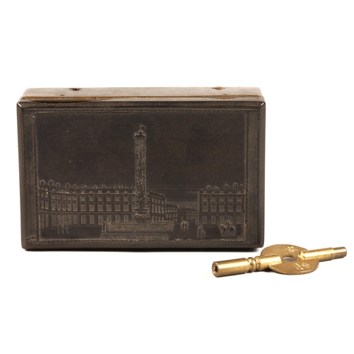 278 - A two air bakelite music box, the lid embossed with the Place Vendome, Paris, with Trajan's Column, ... 