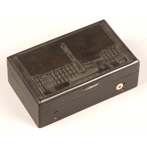 278 - A two air bakelite music box, the lid embossed with the Place Vendome, Paris, with Trajan's Column, ... 