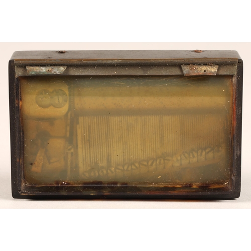 278 - A two air bakelite music box, the lid embossed with the Place Vendome, Paris, with Trajan's Column, ... 